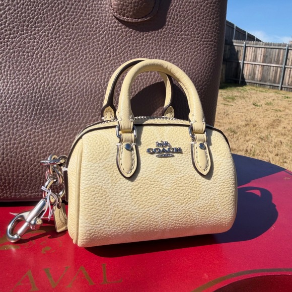 Coach Womens Mini Rowan Bag Charm NWT Pale Yellow Leather Quiet Luxury Keychain - Picture 3 of 5